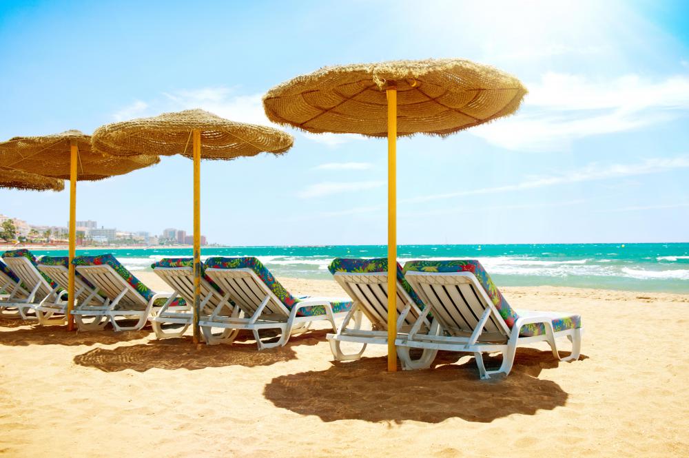 Sun umbrellas are one type of UV protection that's common at the beach.