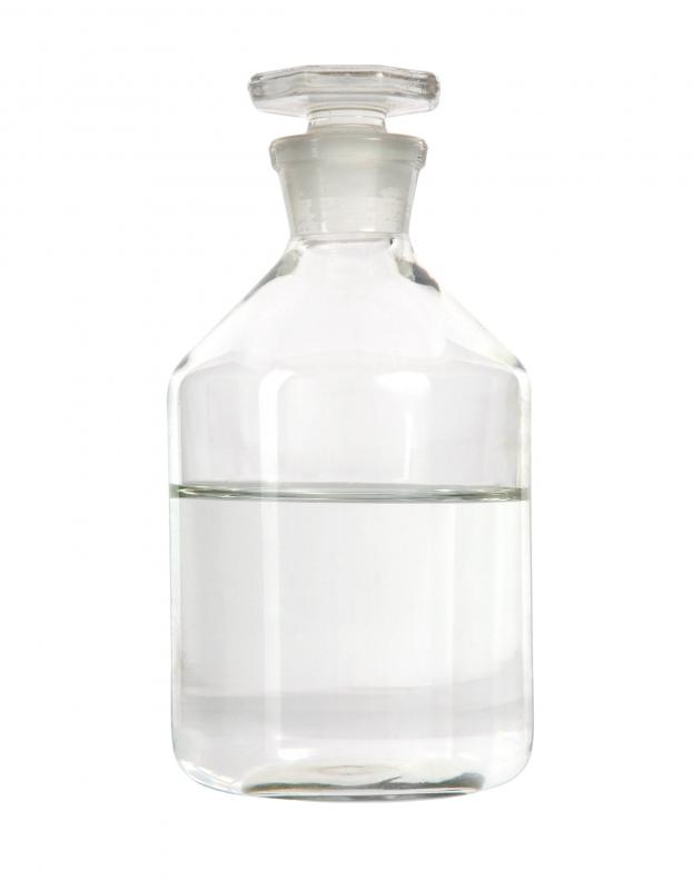 A bottle of rubbing alcohol, which can be used to clean a computer.
