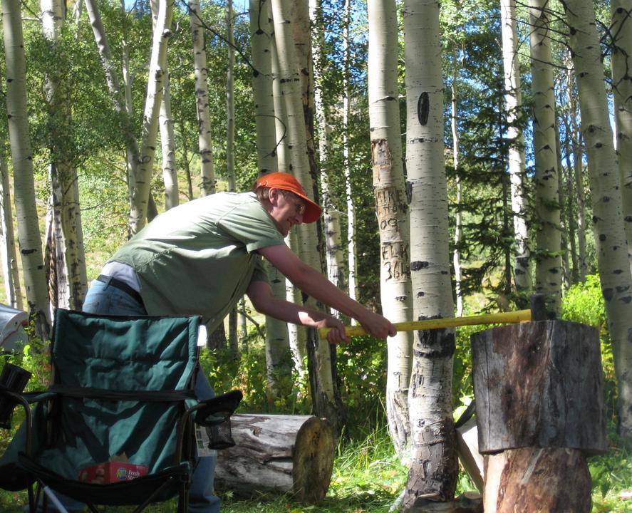 A man using an axe, a type of basic technology.