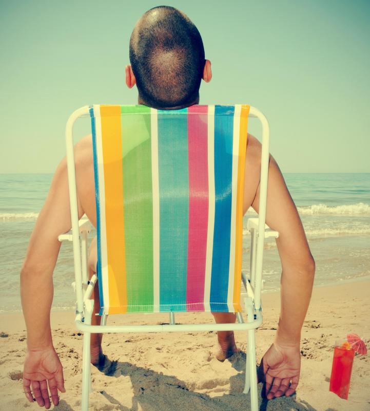 With image editor software, a man photographed while sitting in his backyard can be made to look as if he is sitting in his chair on the beach.