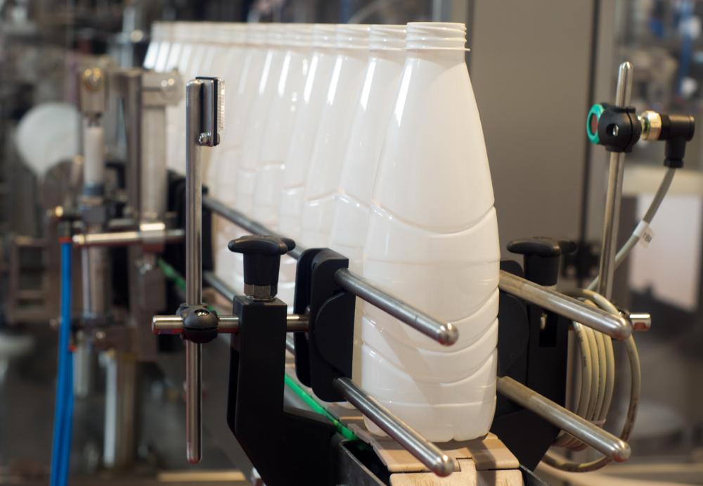 The lid on a milk jug features a threaded coupler to ensure the bottle does not leak.