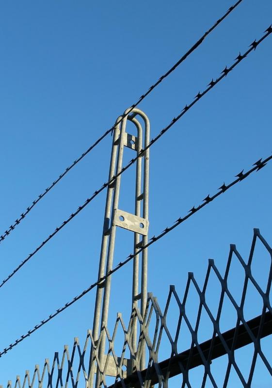 Deployed with cable placed in fences, piezoelectric film has been used in high-security settings, such as prisons.