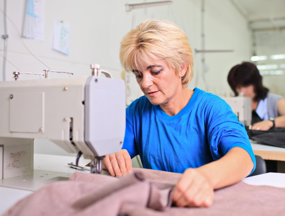 A woman working with a sewing machine.