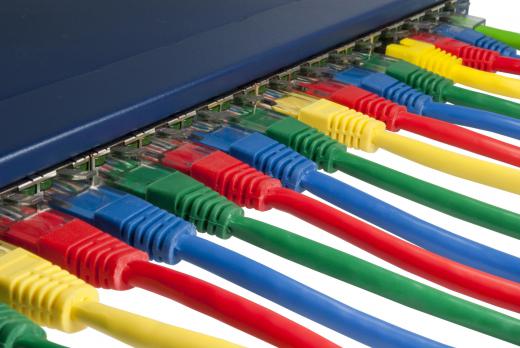 Ethernet cables plugged into an Internet switch.