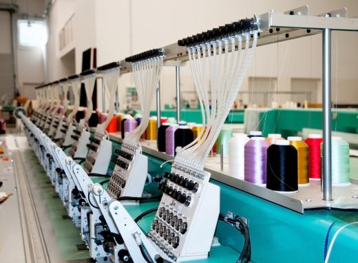 An industrial embroidery machine uses multiple needles that work together automatically.