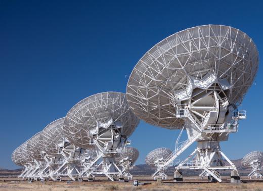 The radio telescope arrays used by astronomers consist of several large radio receivers/transmitters that are linked together.