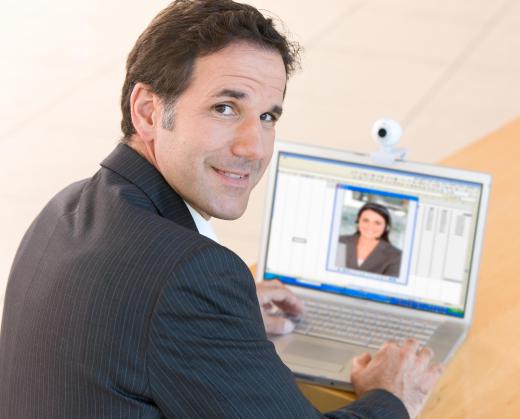 A person using open source web conferencing should look into the camera while speaking, as opposed to the computer screen.