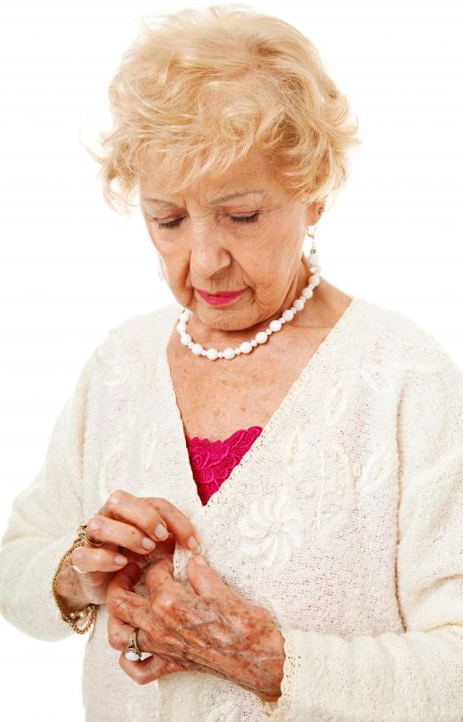 An individual suffering from arthritis may have difficulty performing basic tasks such as getting dressed.