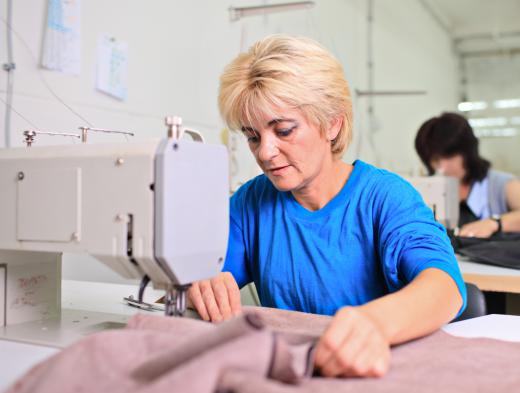 A woman working with a sewing machine.