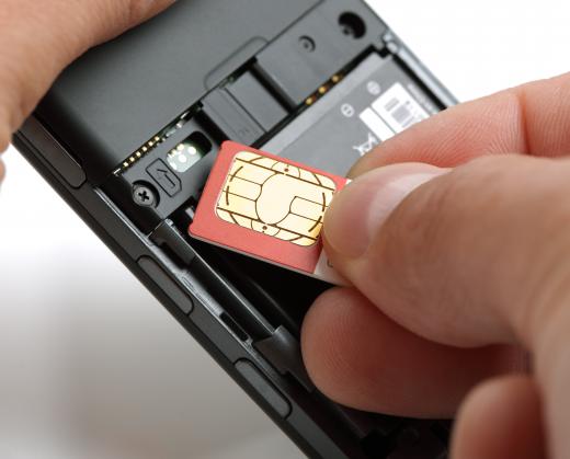 SIM card being placed into a mobile phone.