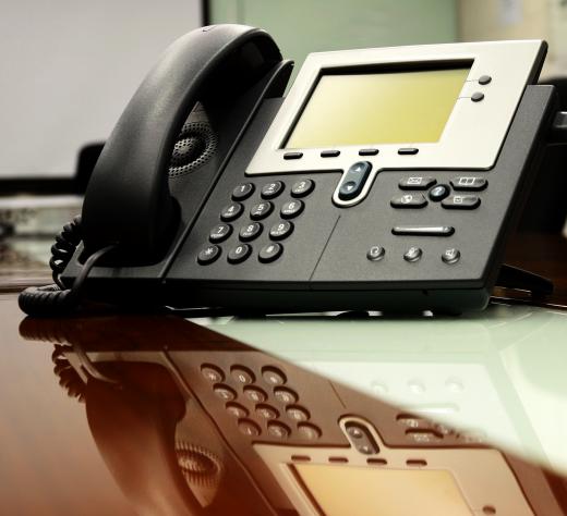 Employees often have digital telephone sets at their individual workstations.