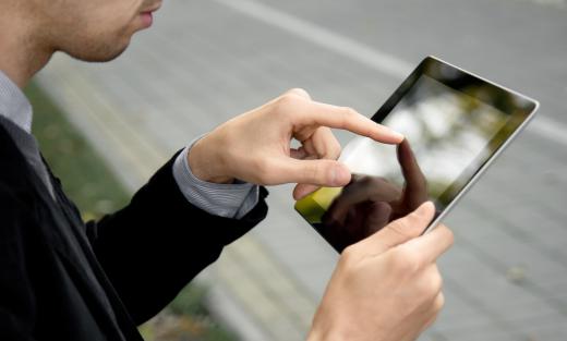 A man using a tablet computer with the Android&trade.