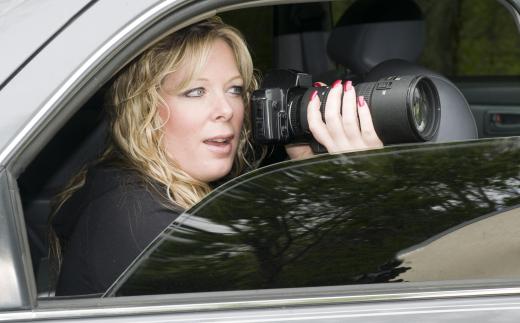 Paparazzi may secretly photograph celebrities and sell the images to websites, newspapers or magazines.